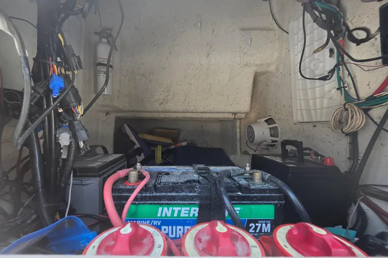 Slide: The Image of Electrical compartment of 2014 Custom Exuma Catamaran 32 with batteries and wiring. - 46
