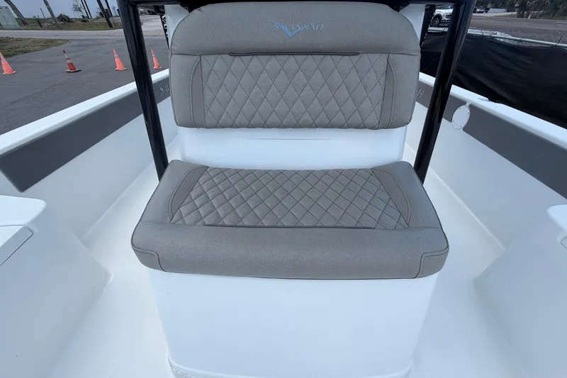 Slide: The Image of 2025 Savannah 210X boat seat with diamond-stitched upholstery, outdoor setting. - 44