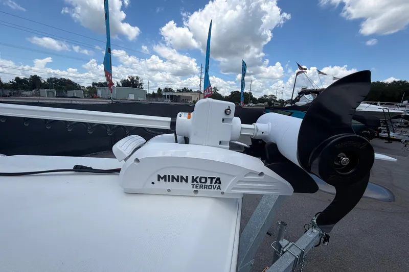 Slide: The Image of Minn Kota Terrova motor on 2025 Savannah 210X boat under cloudy sky. - 40