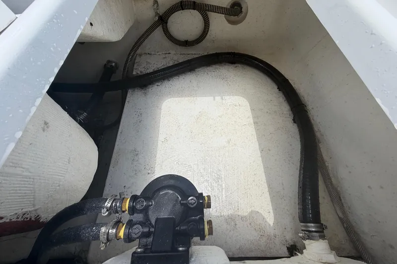 Slide: The Image of Interior view of 2025 Savannah 210X boat showing hoses and fittings. - 56