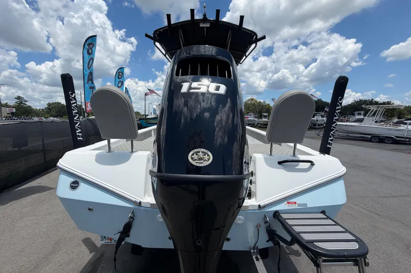 Slide: The Image of 2025 Savannah 210X boat with powerful 150 engine, displayed outdoors under a cloudy sky. - 4