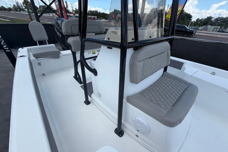 Slide: The Image of 2025 Savannah 210X boat interior with cushioned seating and modern design. - 45