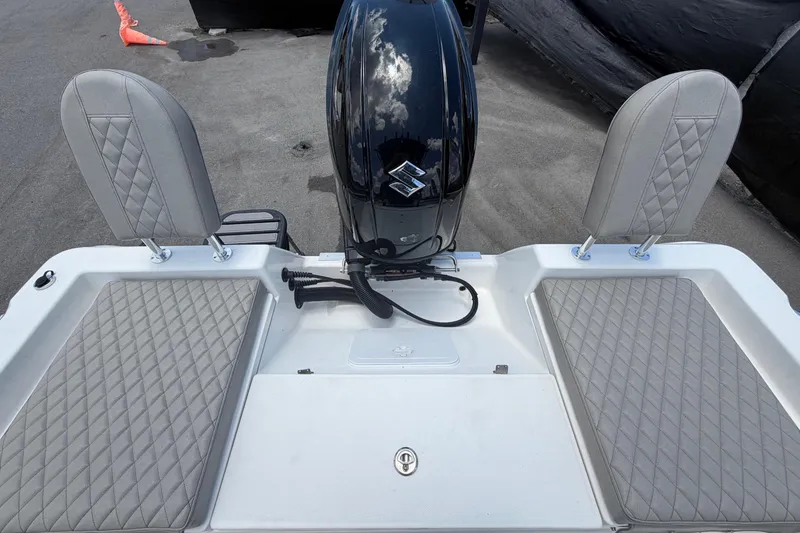 Slide: The Image of 2025 Savannah 210X boat with sleek design and modern outboard motor. - 57