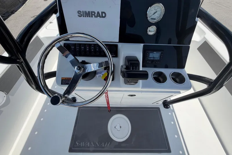 Slide: The Image of Steering console of 2025 Savannah 210X boat with Simrad navigation system. - 16