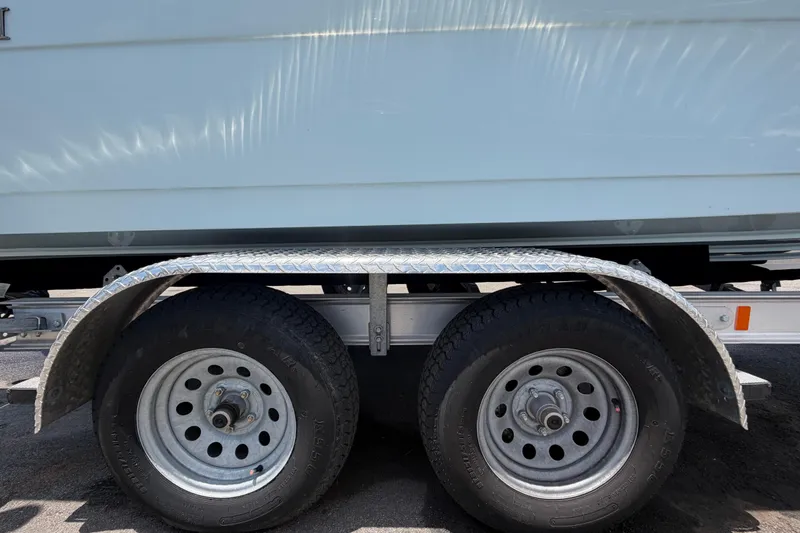 Slide: The Image of Trailer wheels and fender of a 2025 Savannah 210X vehicle. - 63