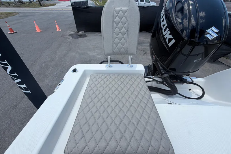 Slide: The Image of 2025 Savannah 210X boat with Suzuki engine, featuring diamond-stitched seating. - 50