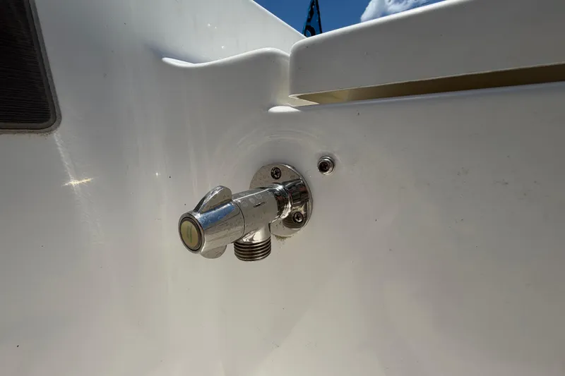 Slide: The Image of Chrome fitting on 2025 Savannah 210X boat, mounted on white surface. - 49