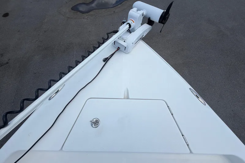 Slide: The Image of Bow of 2025 Savannah 210X boat with trolling motor and storage hatch. - 37