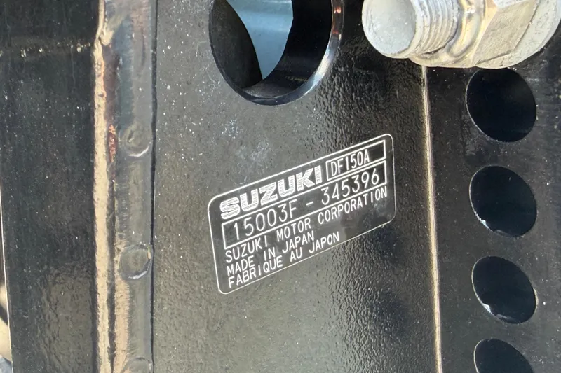 Slide: The Image of Close-up of a Suzuki DF150A engine plate on a Savannah 210X, 2025 model. - 60