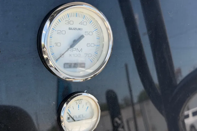 Slide: The Image of Close-up of Suzuki RPM and fuel gauges on a Savannah 210X, 2025 model. - 22