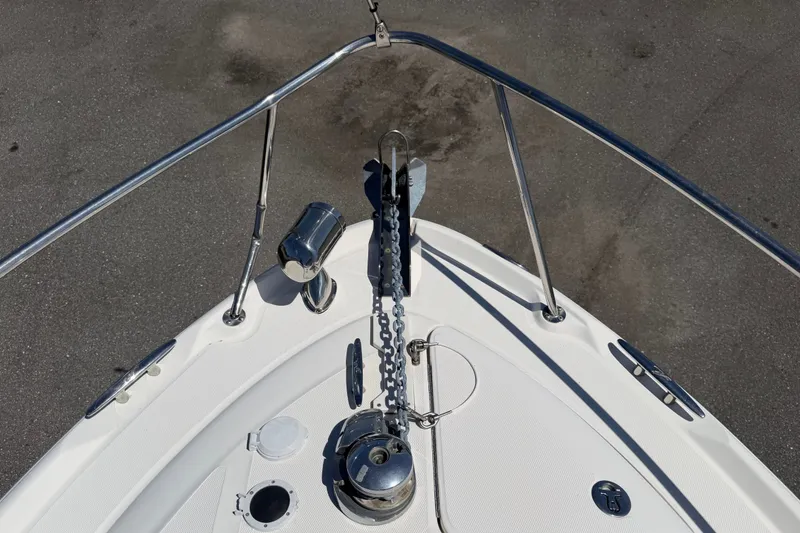 Slide: The Image of Bow view of 2006 Sea Ray 300 Sundancer with anchor chain and railing. - 47
