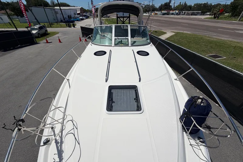 Slide: The Image of 2006 Sea Ray 300 Sundancer boat deck view, showcasing sleek design and spacious layout. - 50