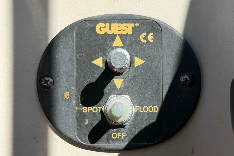 Slide: The Image of Control panel for spotlight and floodlight on a 2006 Sea Ray 300 Sundancer boat. - 38