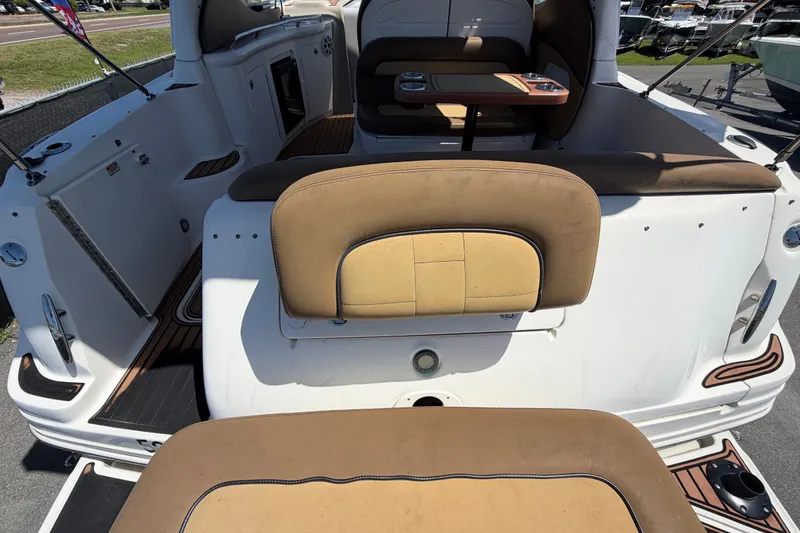 Slide: The Image of 2006 Sea Ray 300 Sundancer boat interior with seating and table setup. - 15