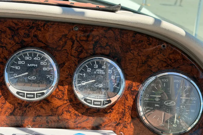 Slide: The Image of Dashboard gauges of a 2006 Sea Ray 300 Sundancer boat. - 36