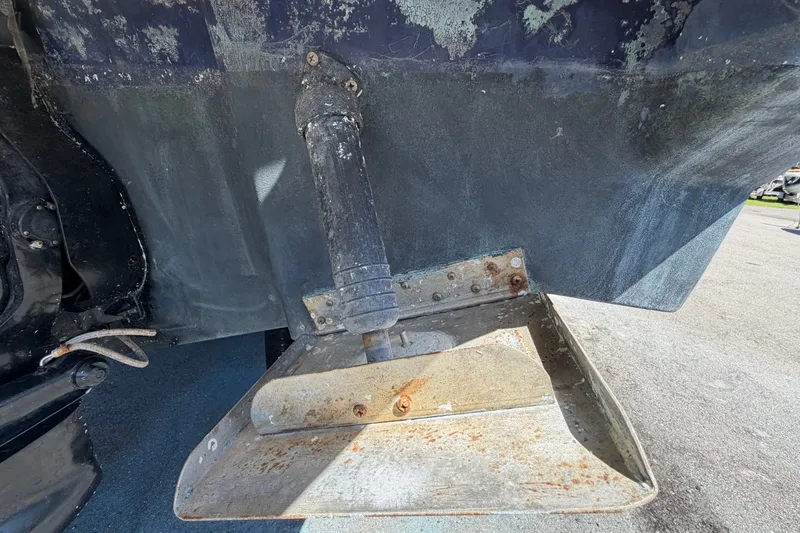 Slide: The Image of Close-up of a 2006 Sea Ray 300 Sundancer boat's stern drive and trim tab. - 7