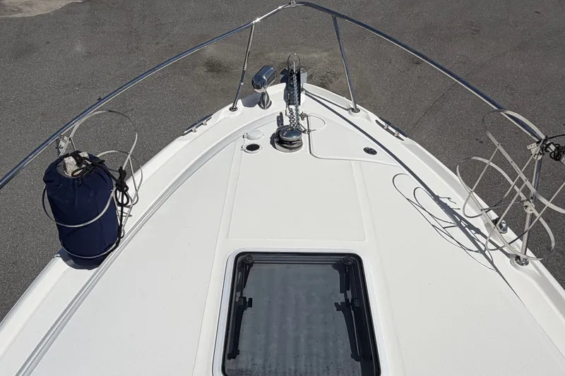 Slide: The Image of Bow view of 2006 Sea Ray 300 Sundancer with anchor and deck features. - 46