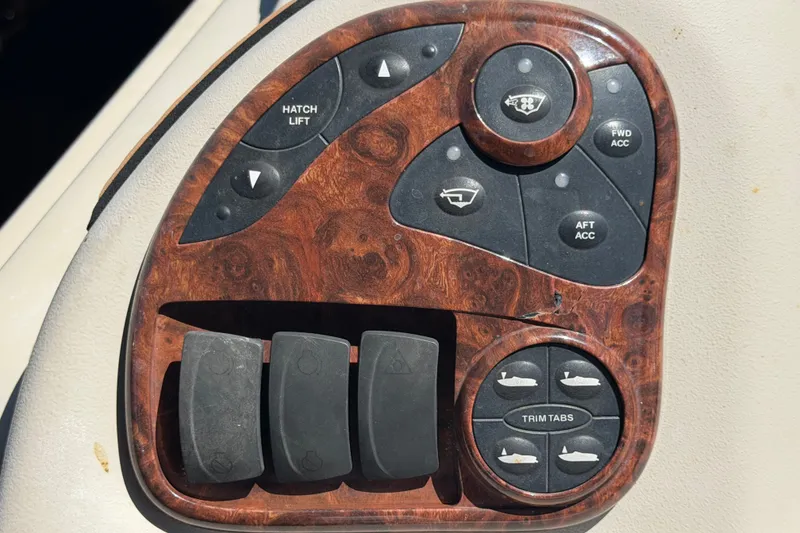 Slide: The Image of Control panel of a 2006 Sea Ray 300 Sundancer boat with wood finish. - 33