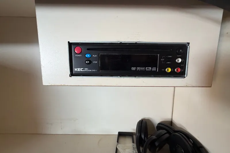 Slide: The Image of KEC mobile DVD player in a 2006 Sea Ray 300 Sundancer boat interior. - 102
