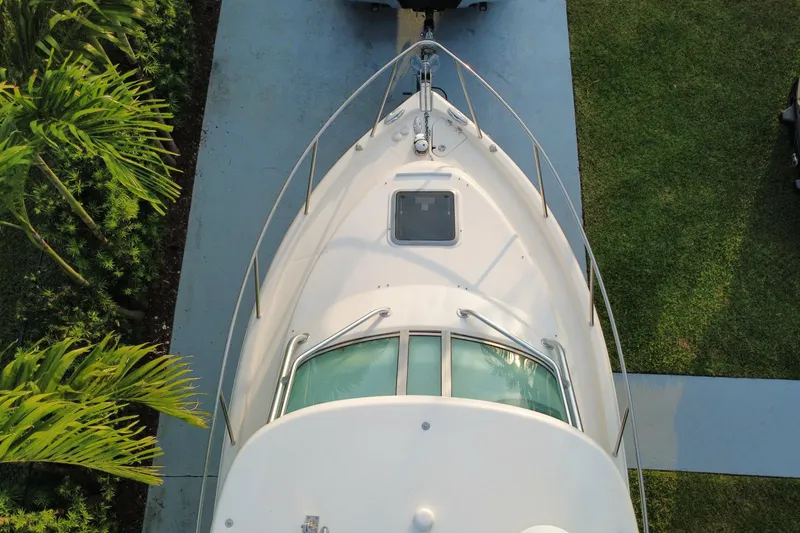 Slide: The Image of Overhead view of 2014 Robalo R265 Walkaround boat on driveway. - 24