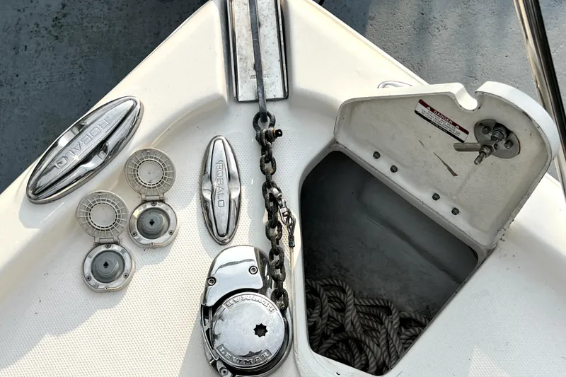 Slide: The Image of 2014 Robalo R265 Walkaround boat anchor compartment with chain and rope storage. - 97