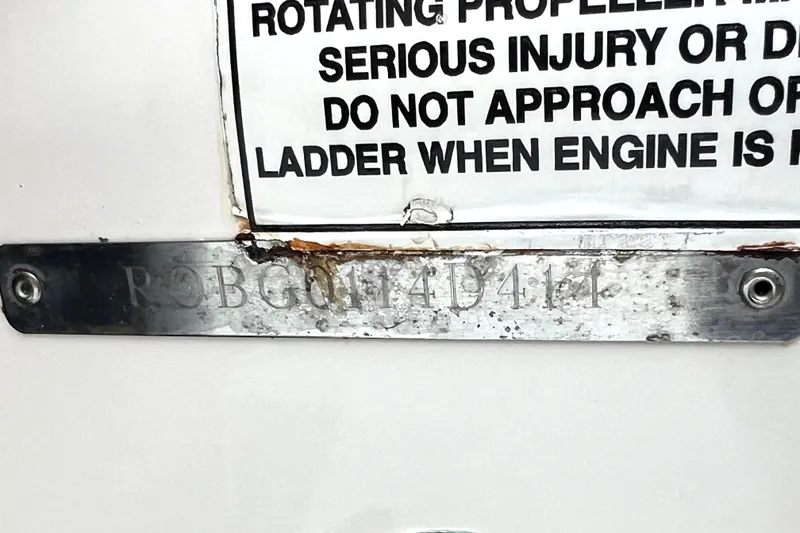 Slide: The Image of 2014 Robalo R265 Walkaround boat identification plate with safety warning label. - 21