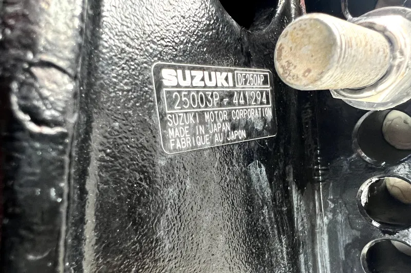 Slide: The Image of Suzuki DF250AP engine plate on 2014 Robalo R265 Walkaround boat. - 22