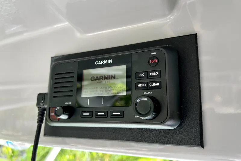 Slide: The Image of Garmin VHF 115 radio installed on 2014 Robalo R265 Walkaround boat. - 84