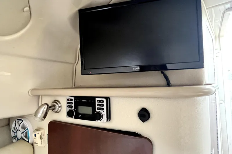 Slide: The Image of Interior of 2014 Robalo R265 Walkaround with TV and stereo system. - 117