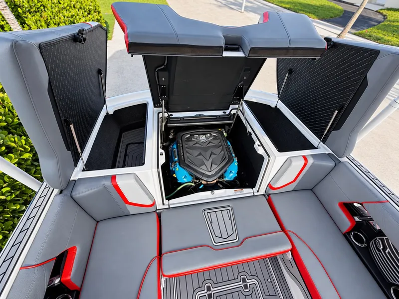 Slide: The Image of The 2019 Nautique Super Air Nautique G23 features an open engine compartment with blue accents. - 8