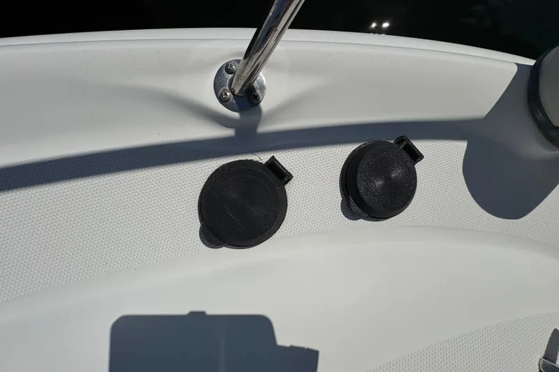 Slide: The Image of Close-up of a 2006 Sea Ray 340 Sundancer boat deck with two black caps. - 54