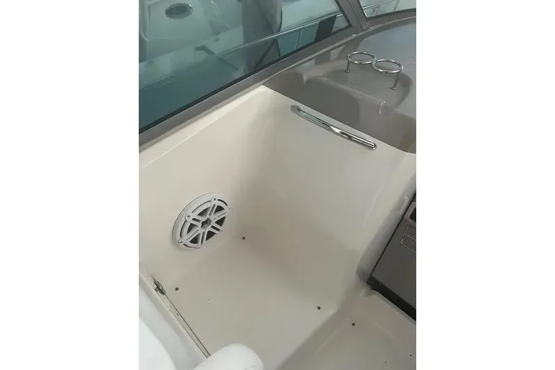 Slide: The Image of Interior view of 2006 Sea Ray 340 Sundancer boat with speaker and cup holders. - 13