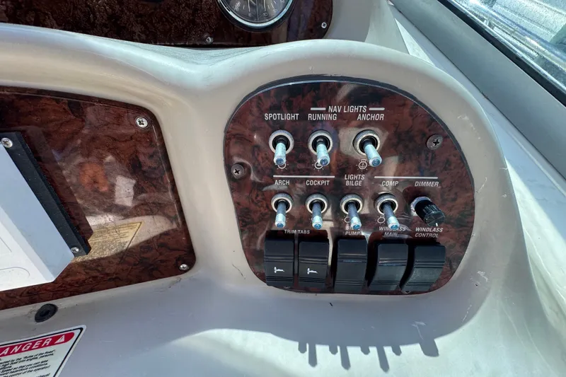 Slide: The Image of Control panel of a 2006 Sea Ray 340 Sundancer boat with various switches. - 41