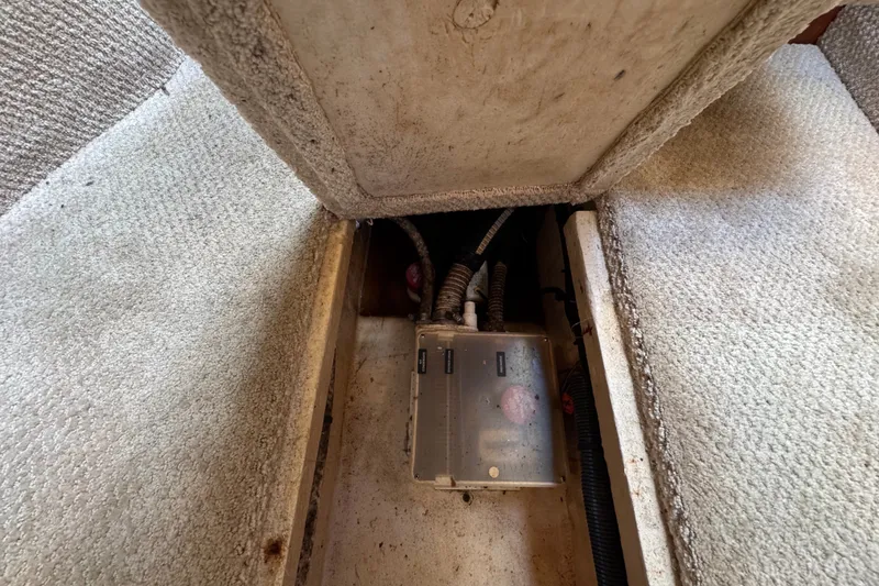 Slide: The Image of Electrical compartment of a 2006 Sea Ray 340 Sundancer boat, showing wiring and components. - 100
