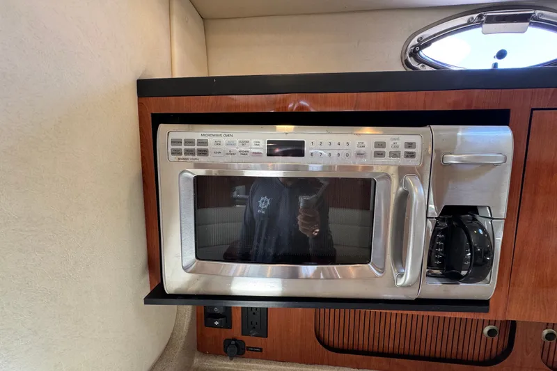 Slide: The Image of Built-in microwave and coffee maker in 2006 Sea Ray 340 Sundancer yacht galley. - 84