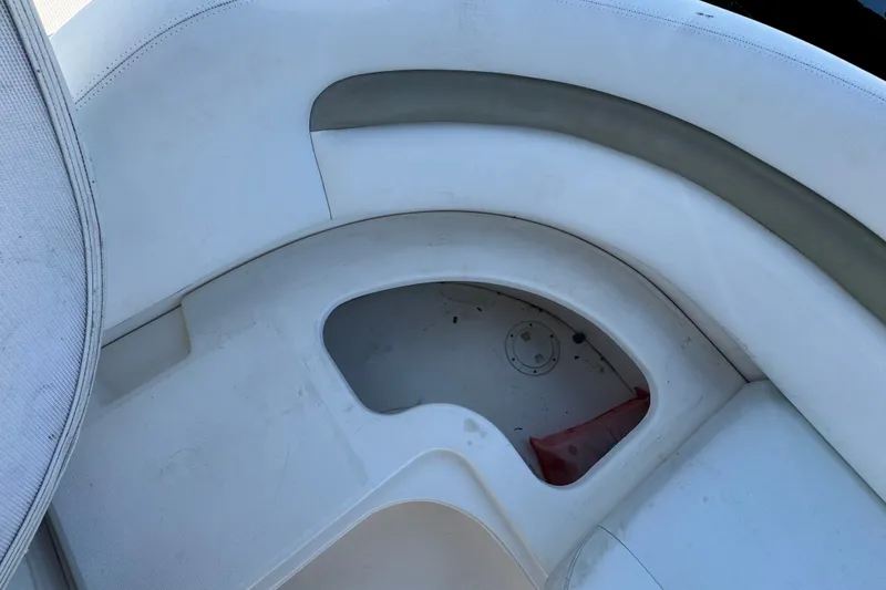 Slide: The Image of 2006 Sea Ray 340 Sundancer boat seating area with storage compartment. - 23
