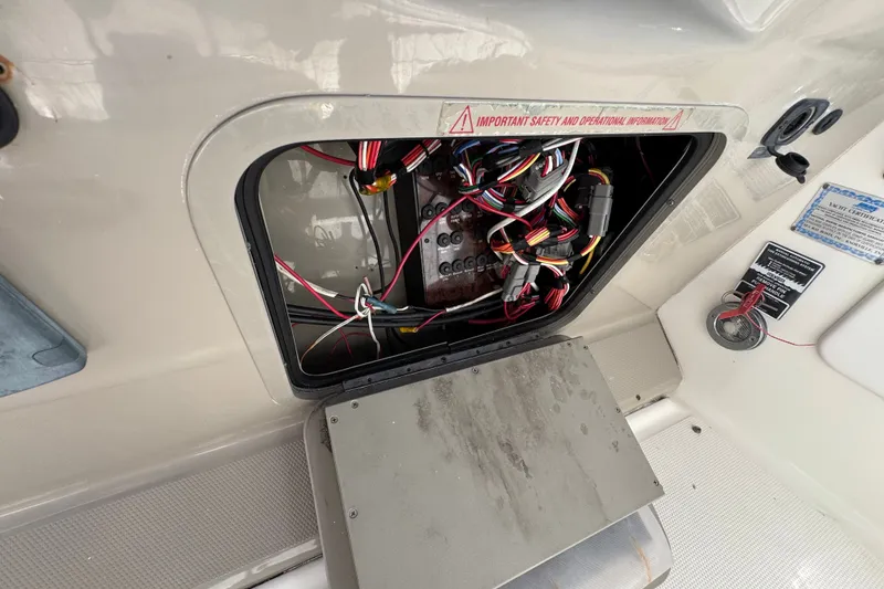 Slide: The Image of Open electrical panel with wiring on a 2006 Sea Ray 340 Sundancer boat. - 36