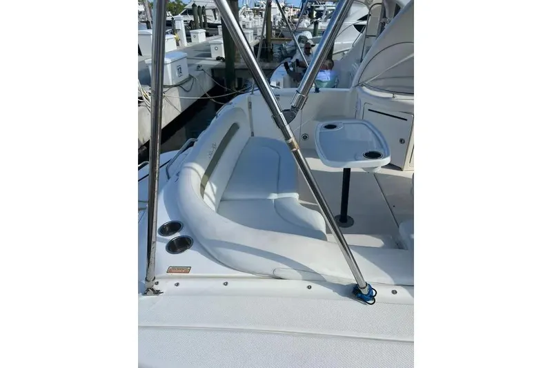 Slide: The Image of 2006 Sea Ray 340 Sundancer boat interior with seating and table at marina. - 19