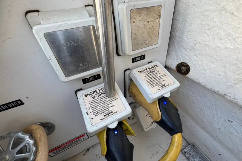 Slide: The Image of Shore power connections on a 2006 Sea Ray 340 Sundancer boat. - 16