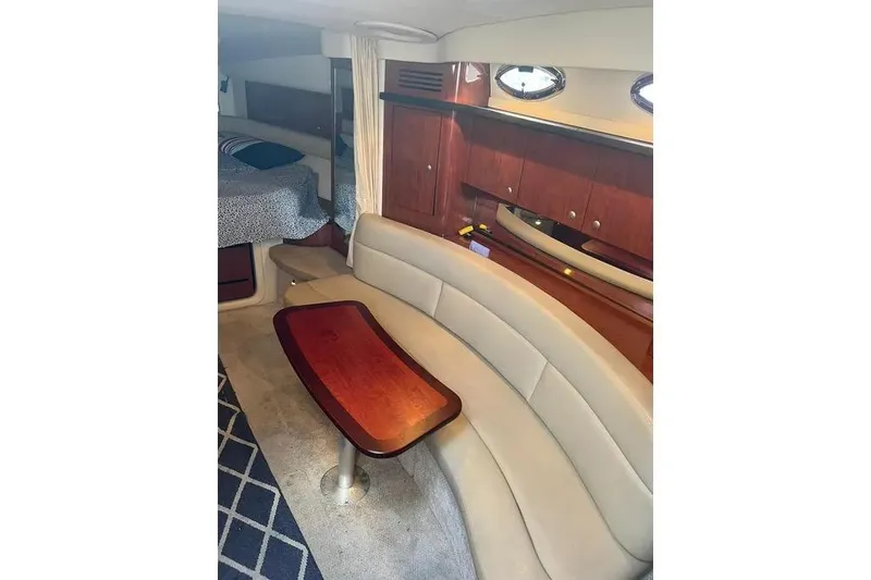 Slide: The Image of Luxurious interior of 2006 Sea Ray 340 Sundancer with elegant seating and wooden cabinetry. - 14