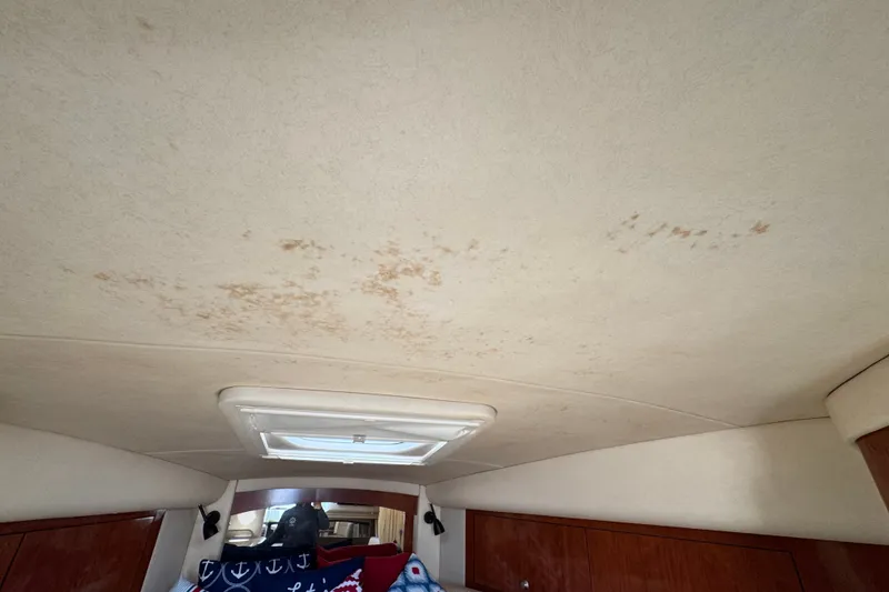 Slide: The Image of Interior ceiling of a 2006 Sea Ray 340 Sundancer with visible water stains. - 66