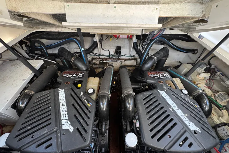 Slide: The Image of Engine compartment of a 2006 Sea Ray 340 Sundancer with twin Mercury 8.1S motors. - 102