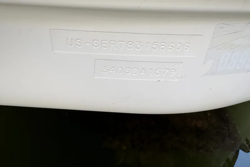 Slide: The Image of 2006 Sea Ray 340 Sundancer hull identification number on white surface. - 109