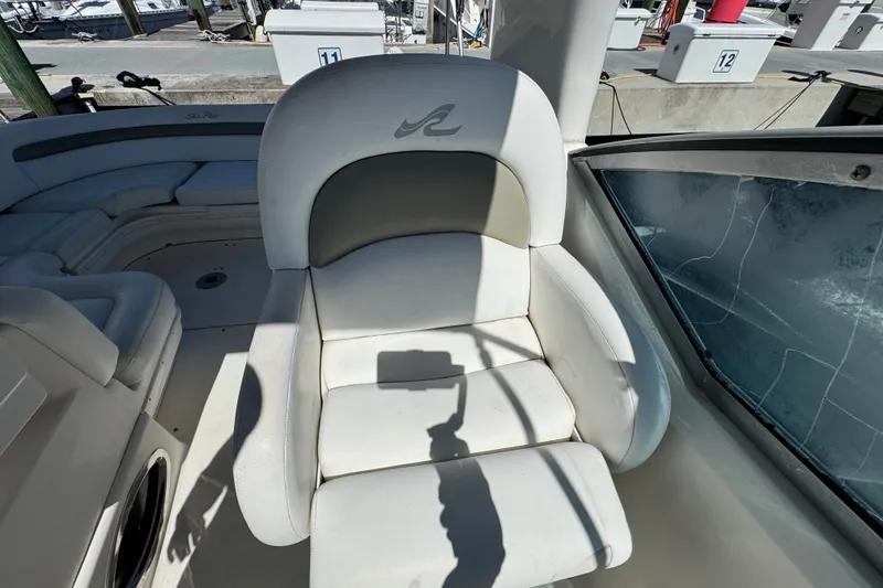 Slide: The Image of Captain's chair on 2006 Sea Ray 340 Sundancer boat, docked at marina. - 32