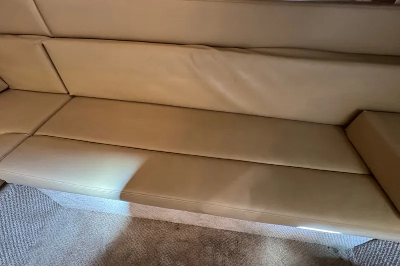 Slide: The Image of Beige leather seating on 2006 Sea Ray 340 Sundancer yacht interior. - 70