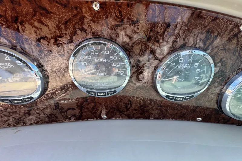 Slide: The Image of Dashboard gauges of a 2006 Sea Ray 340 Sundancer boat. - 46