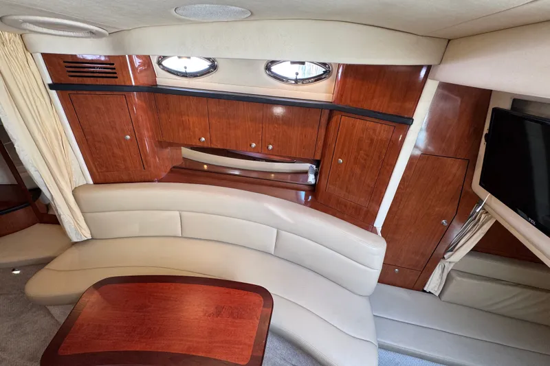 Slide: The Image of Interior of 2006 Sea Ray 340 Sundancer yacht with elegant wood cabinetry and plush seating. - 63