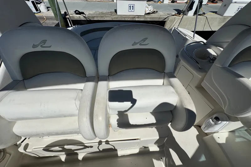 Slide: The Image of 2006 Sea Ray 340 Sundancer cockpit with dual seats and helm station. - 34