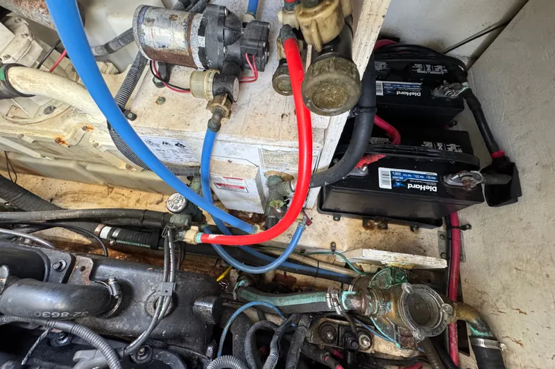 Slide: The Image of Engine compartment of a 2006 Sea Ray 340 Sundancer with batteries and wiring. - 105
