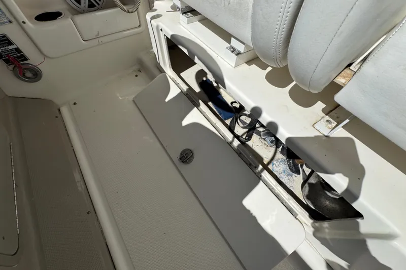 Slide: The Image of Interior view of a 2006 Sea Ray 340 Sundancer boat, featuring seating and storage. - 35